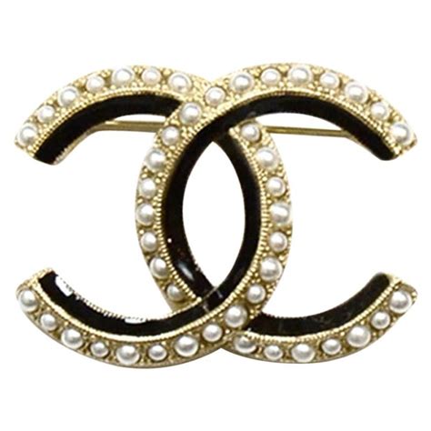 chanel brooch black and gold|Chanel pearl brooch price.